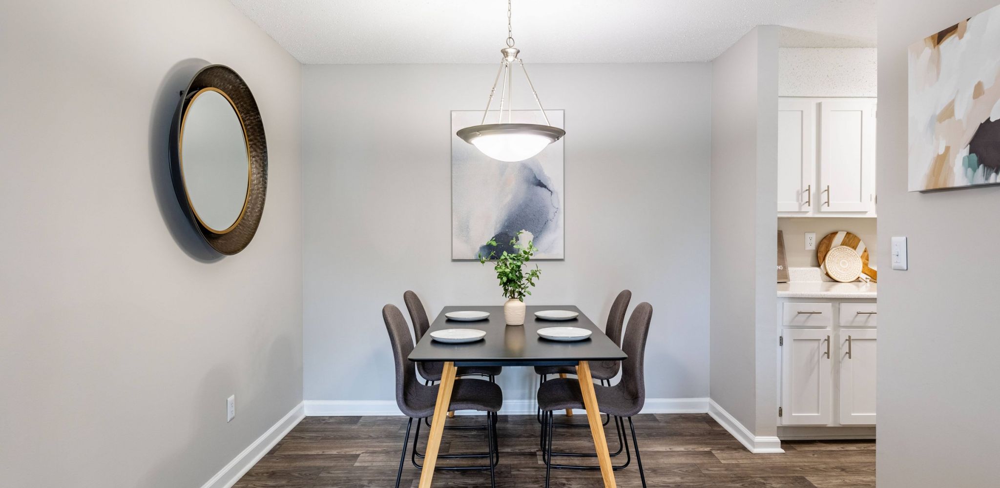 Hawthorne at the Ridge apartment dining area with table and chairs looking towards the beautiful kitchen