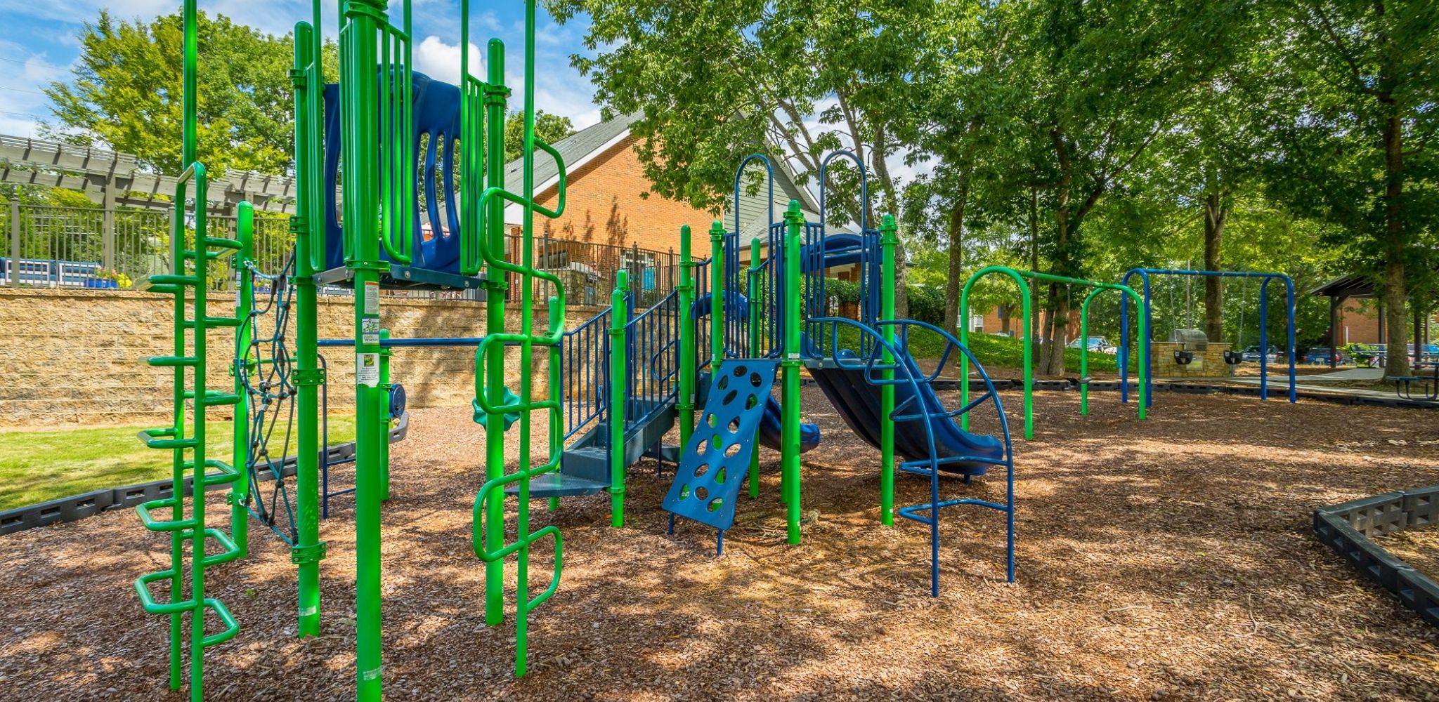 Hawthorne at the Ridge outdoor playground with slide, swings, and more